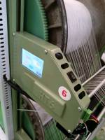 Automatic adjustment system of warp tension of textile equipment